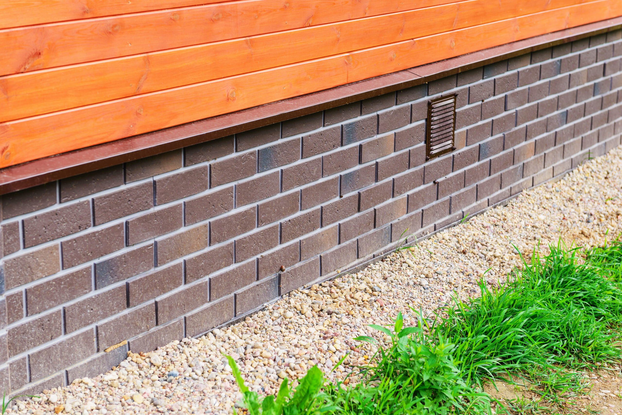 Foundation plating with imitation brick in a private house